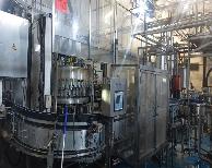 Maszyny rozlewnicze do butelek szklanych do wody i napojów niegazowanych KRONES Mecafill 40-50-10 